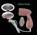 Pink Sokany corded steam ironing brush for clothes on a table.
