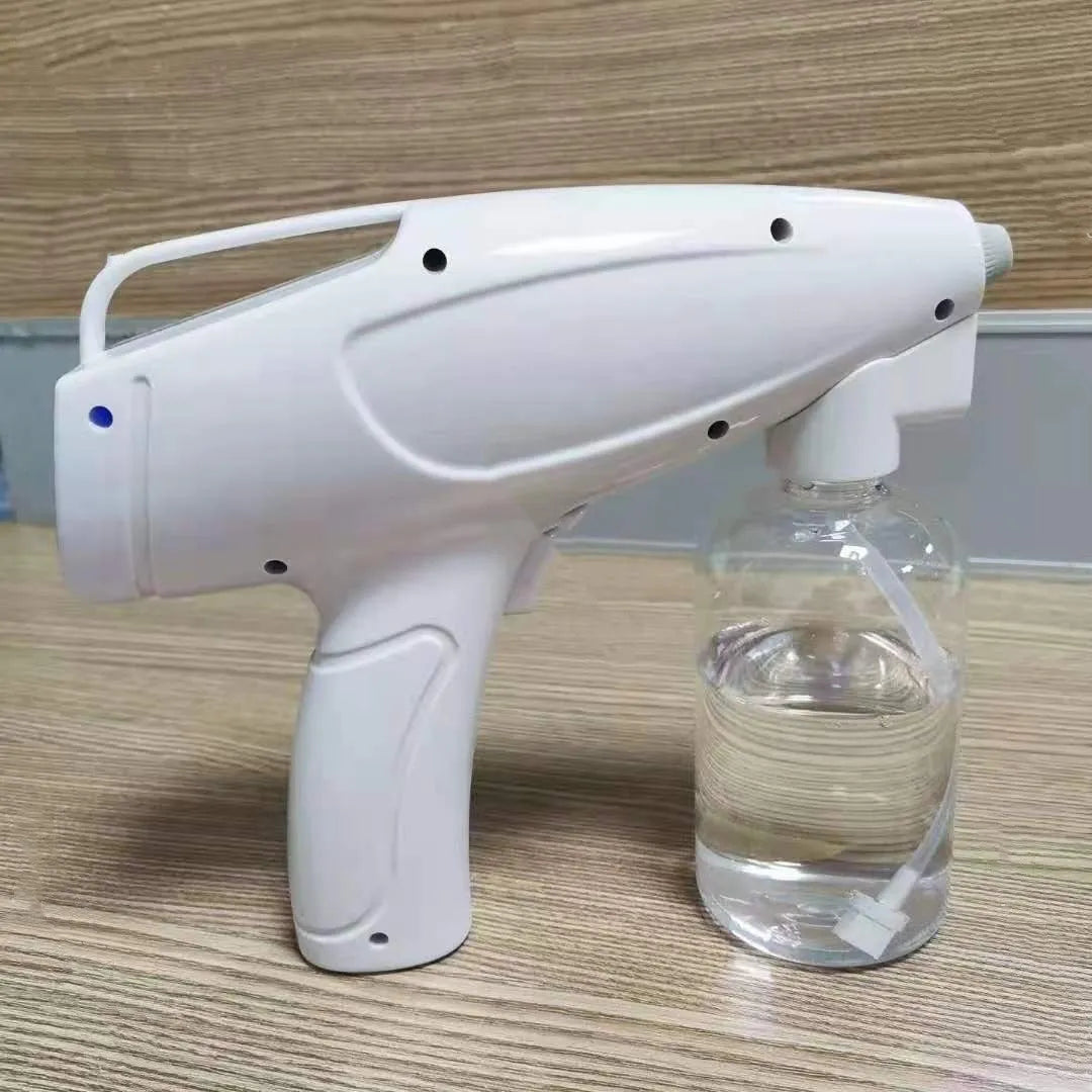 White handheld cordless electric spray disinfection gun with USB charging port