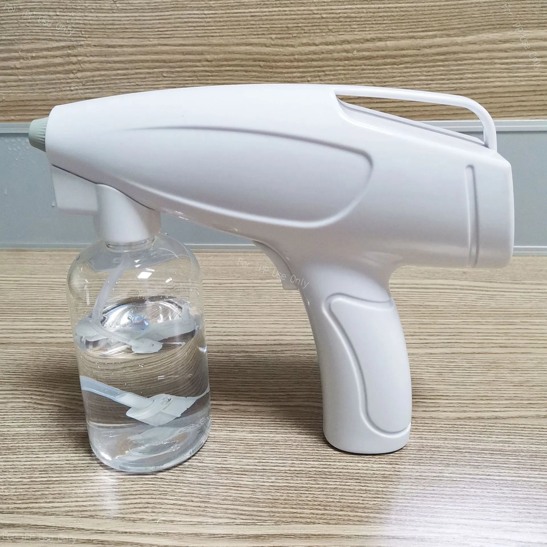 White handheld cordless electric spray disinfection gun with USB charging port