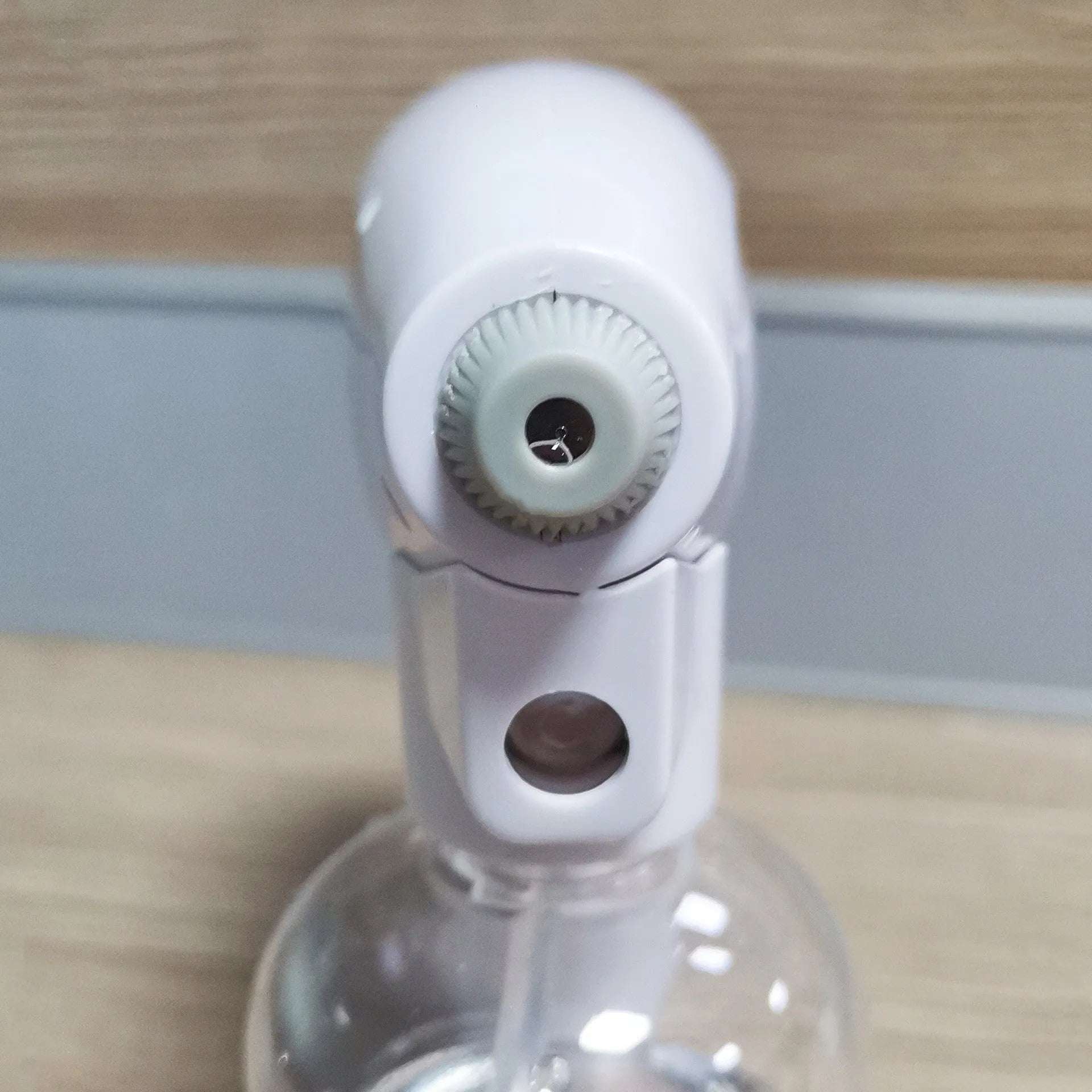 White handheld cordless electric spray disinfection gun with USB charging port