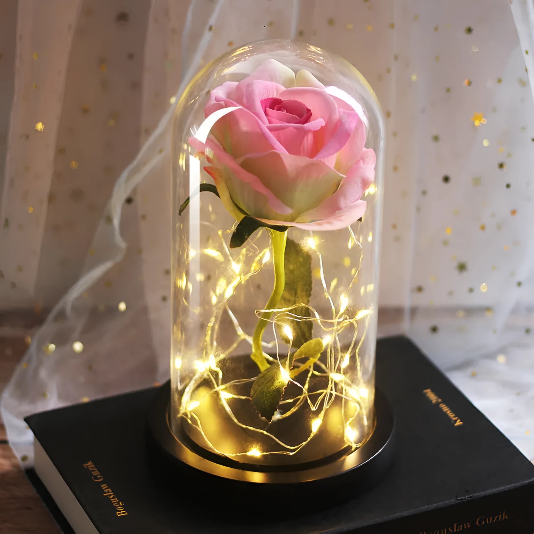 LED rose ornament with silk flowers under glass shade, showing colour options on a wooden base.