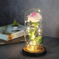 LED rose ornament with silk flowers under glass shade, showing colour options on a wooden base.
