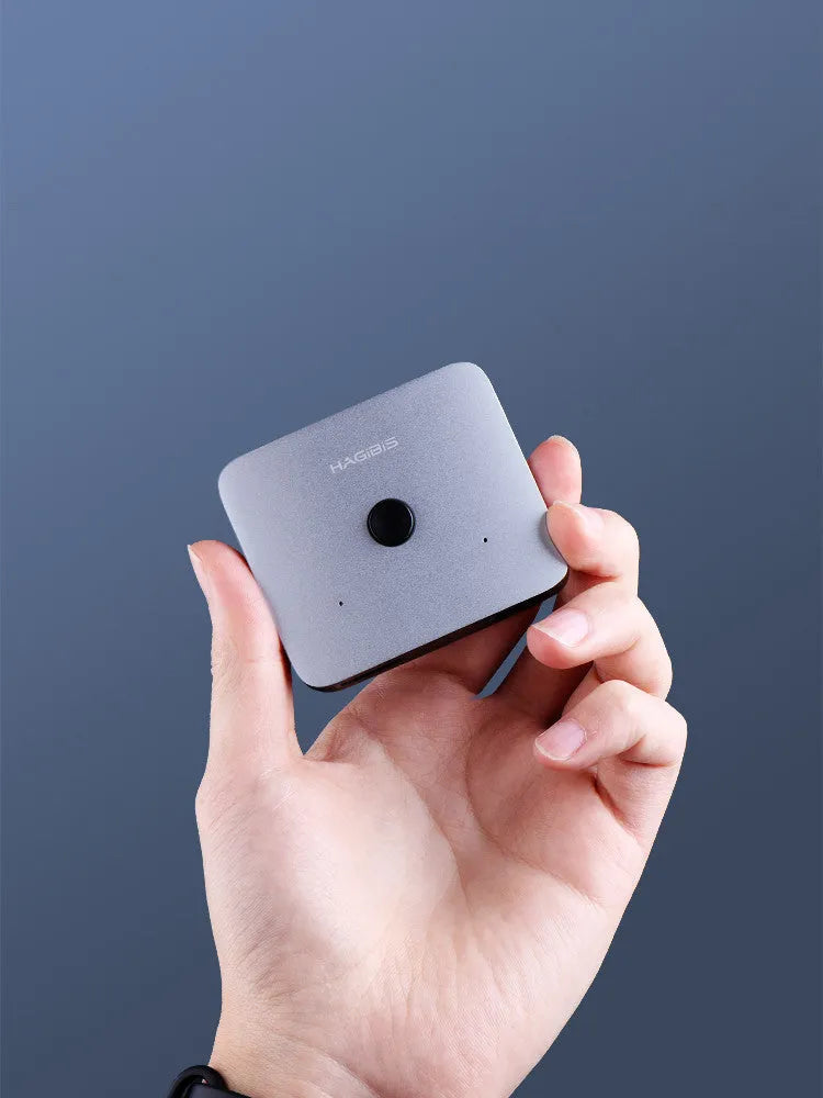 Gray Haibeisi HDMI switcher unit showing one input and two output ports for splitting a video signal.