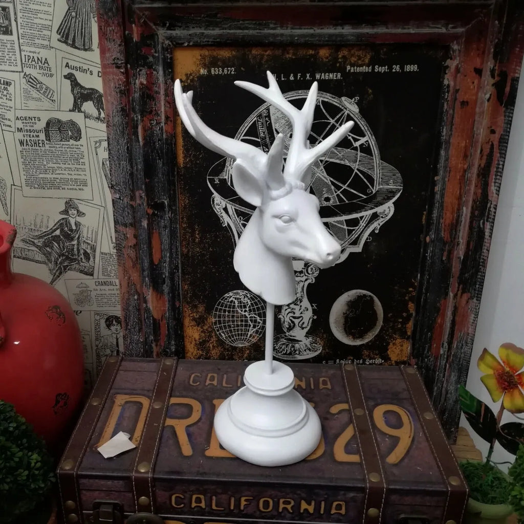 A solid natural resin animal sculpture for home decoration in black, white, or wood colour.