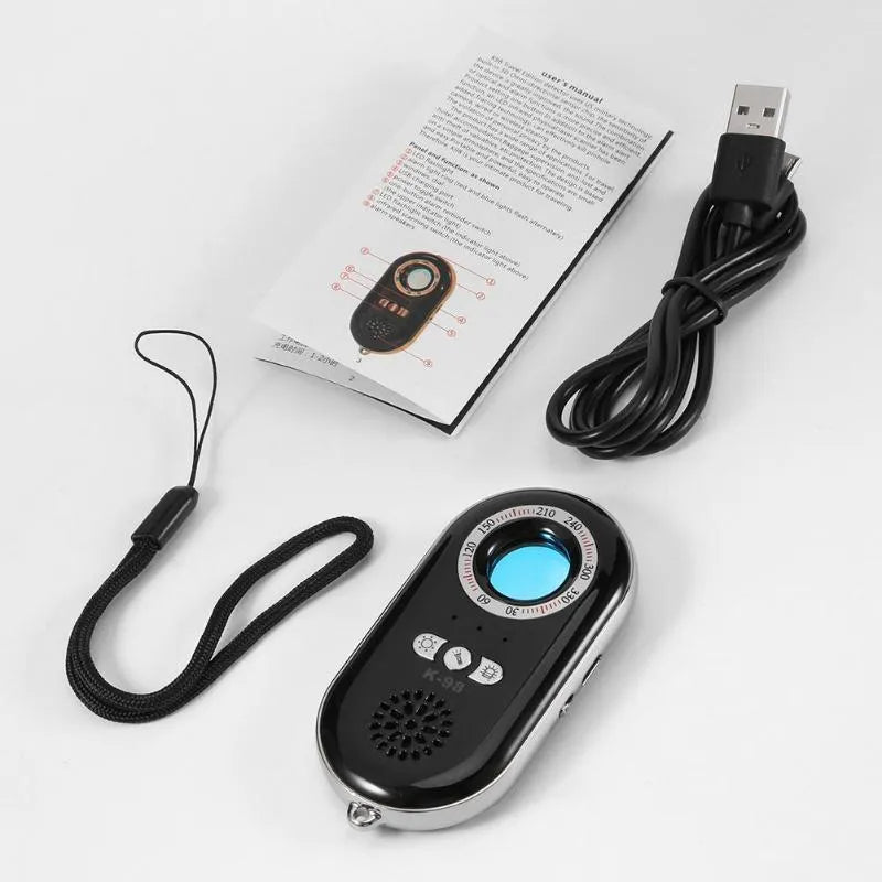 Compact black wireless signal detector with vibration alarm for anti-theft security measuring 85mm in length