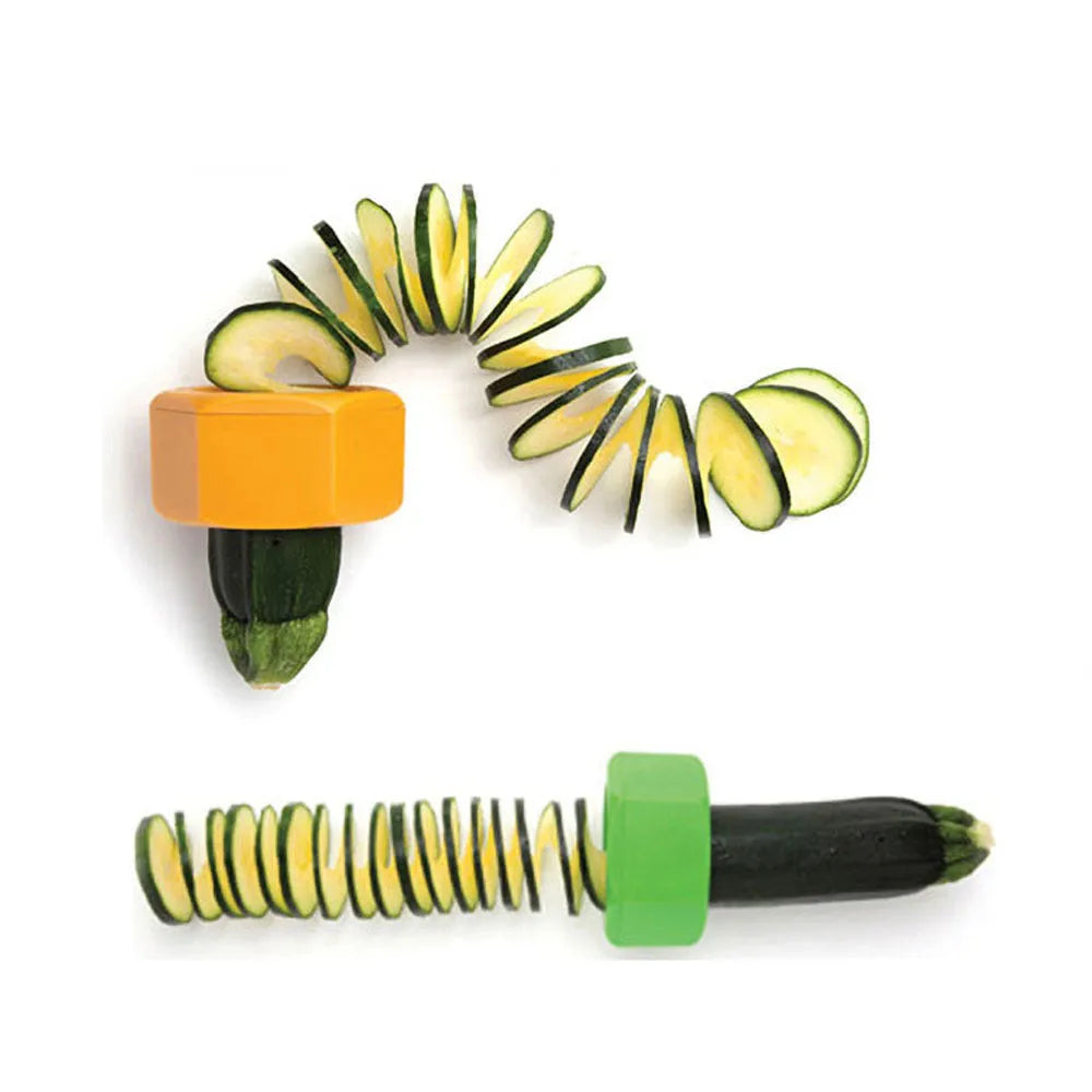Yellow and green kitchen vegetable cutter with spiral knife mechanism for slicing cucumbers