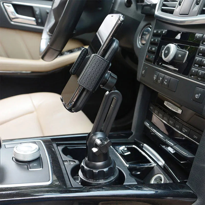 Black ABS car phone holder with 360-degree rotating head and adjustable height bracket on a car dashboard.