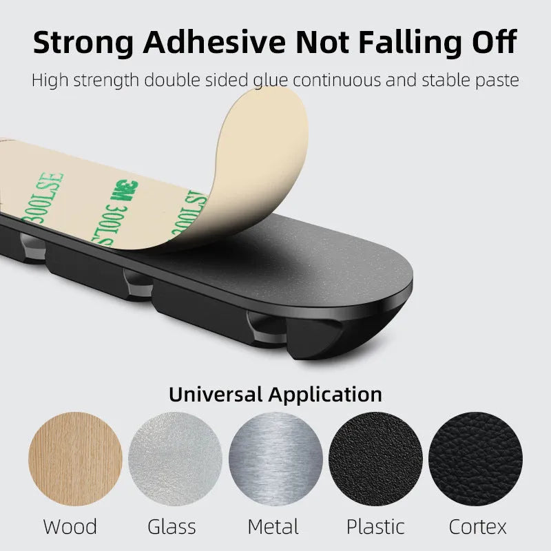 Black soft plastic desktop cable organiser with magnetic charging cable holder.