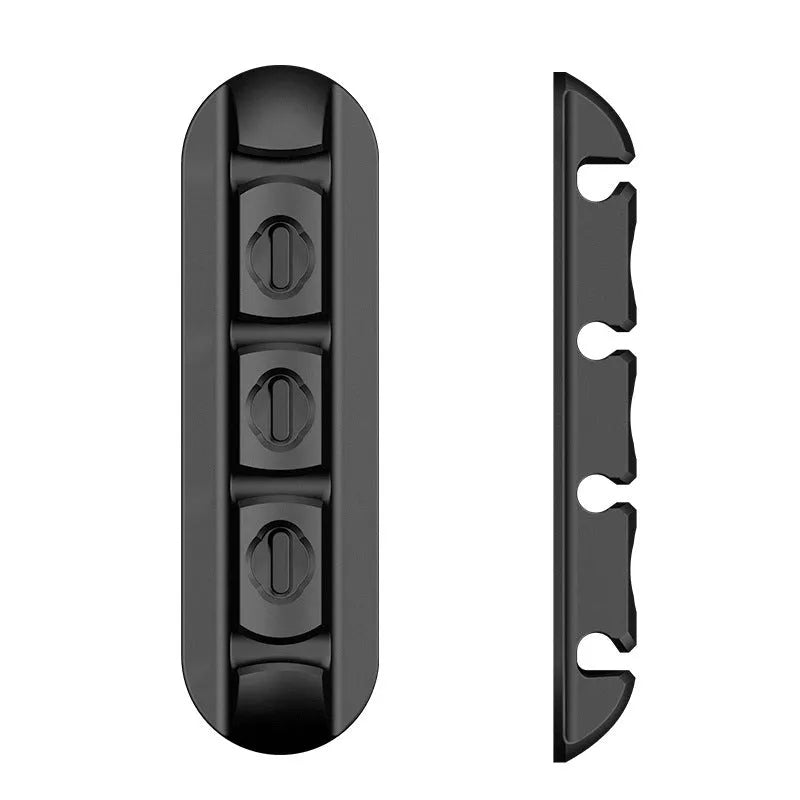Black soft plastic desktop cable organiser with magnetic charging cable holder.