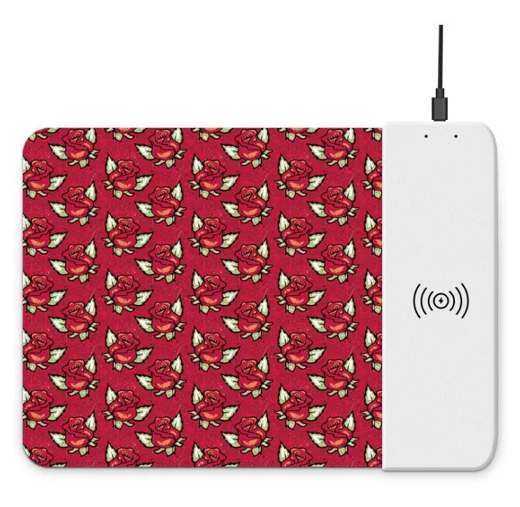 Black wireless charging mouse pad with cartoon design, RGB edge lighting, and non-slip rubber base.