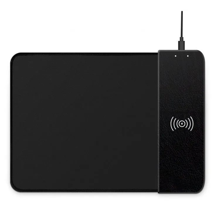 Black wireless charging mouse pad with cartoon design, RGB edge lighting, and non-slip rubber base.