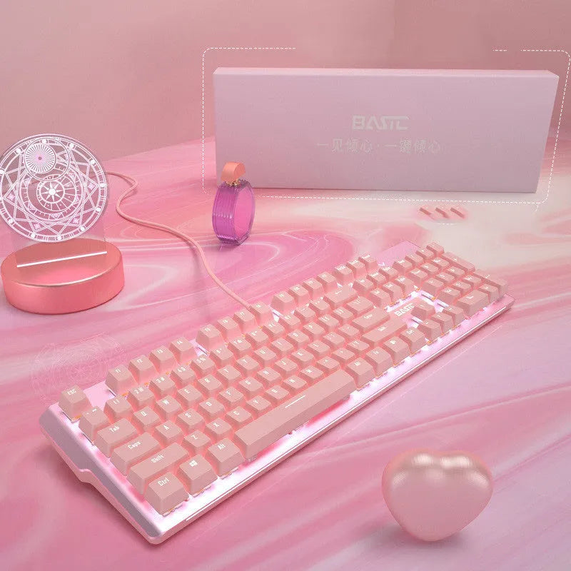 Pink mechanical keyboard and wired mouse gaming set on desk
