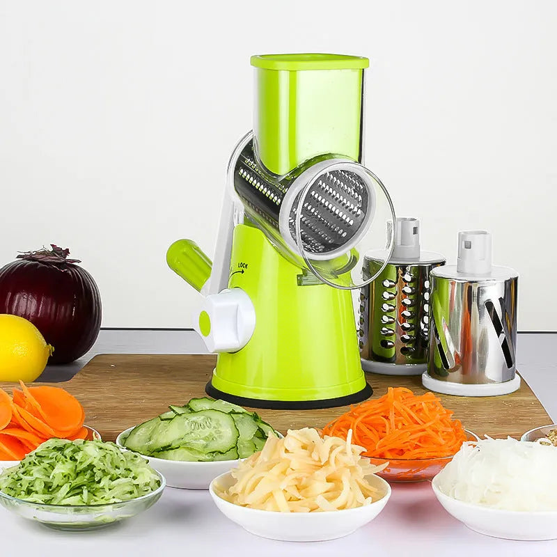 Blue multi-function vegetable chopper with slicer, grater and suction cup base on a kitchen counter.