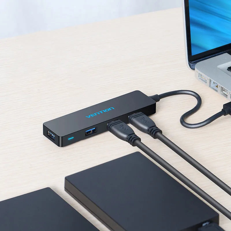 Black four-port USB 3.0 hub with 0.15m cable showing USB connectors