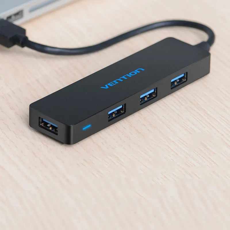 Black four-port USB 3.0 hub with 0.15m cable showing USB connectors