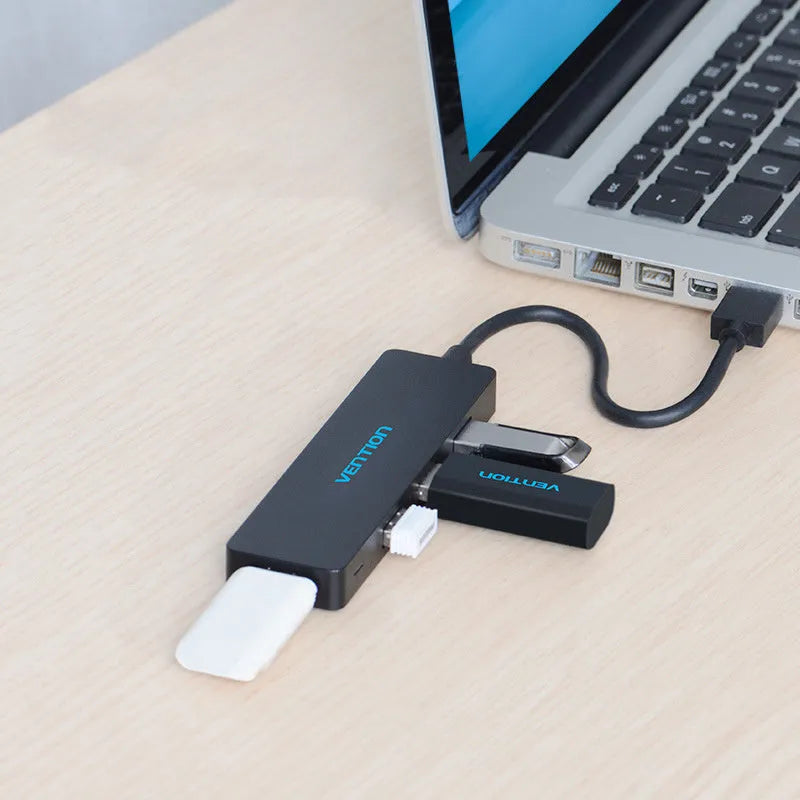 Black four-port USB 3.0 hub with 0.15m cable showing USB connectors