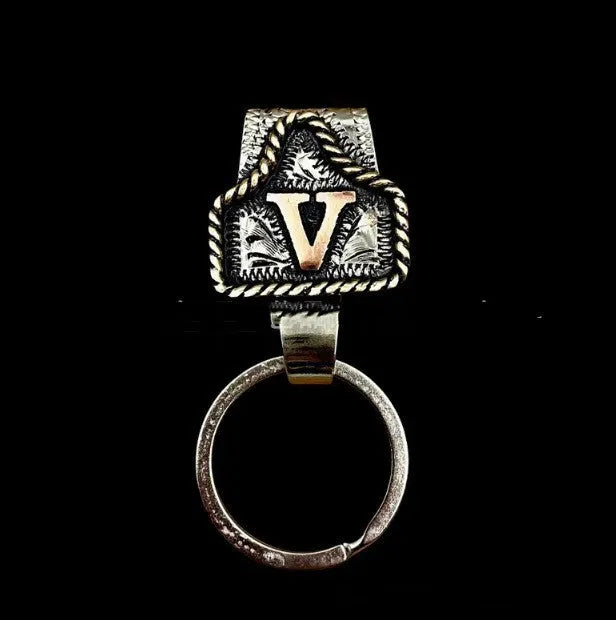 Handmade metal cow tag belt key holder keychain on a key ring, showing the metal loop and tag design.