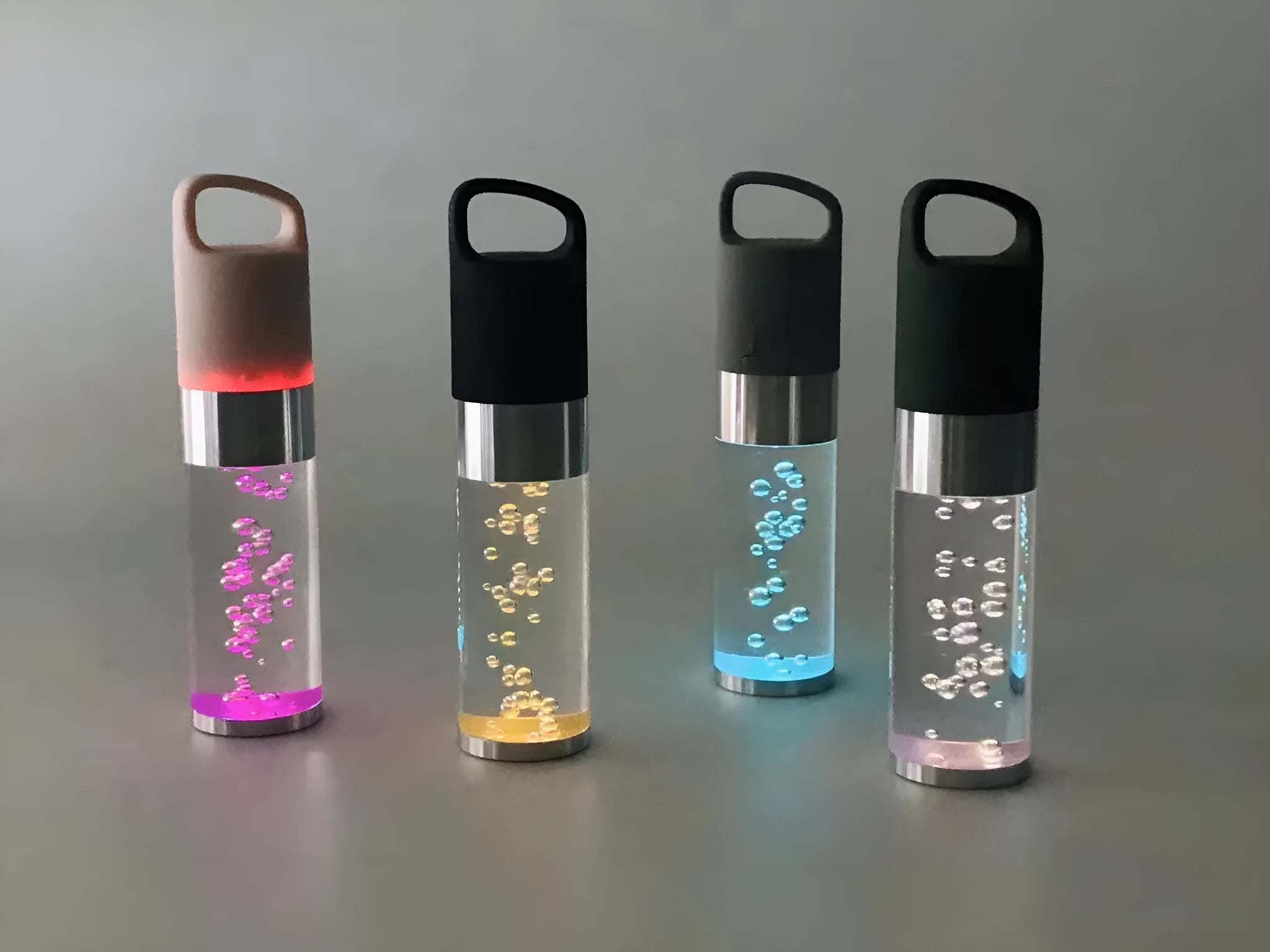 Portable Bluetooth speaker with colourful crystal light in pink, black, silver grey, or green