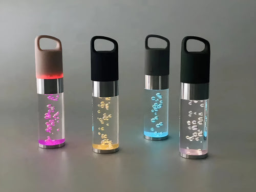 Portable Bluetooth speaker with colourful crystal light in pink, black, silver grey, or green