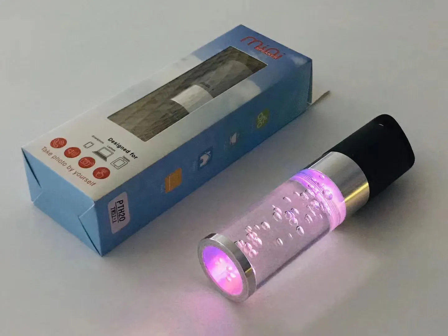 Portable Bluetooth speaker with colourful crystal light in pink, black, silver grey, or green
