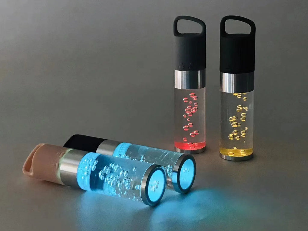 Portable Bluetooth speaker with colourful crystal light in pink, black, silver grey, or green