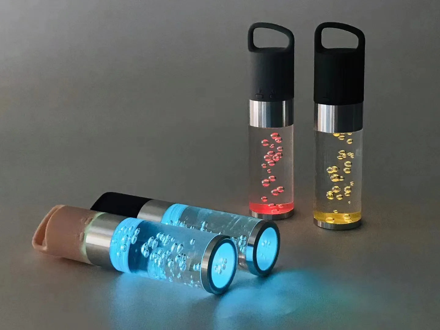 Portable Bluetooth speaker with colourful crystal light in pink, black, silver grey, or green