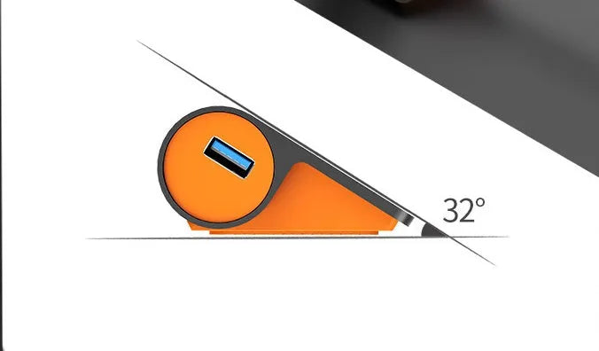 Dark grey aluminium USB hub with four ports, orange accents and detachable cable beside laptop