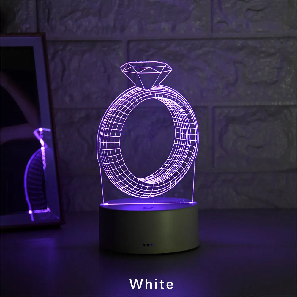 3D LED night light projecting illuminated diamond ring image with colour-changing glow.