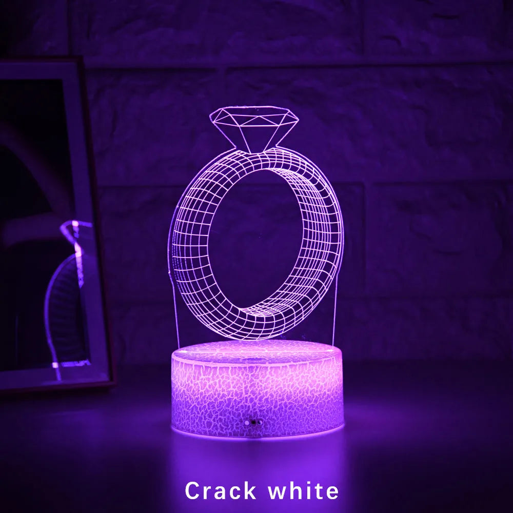 3D LED night light projecting illuminated diamond ring image with colour-changing glow.