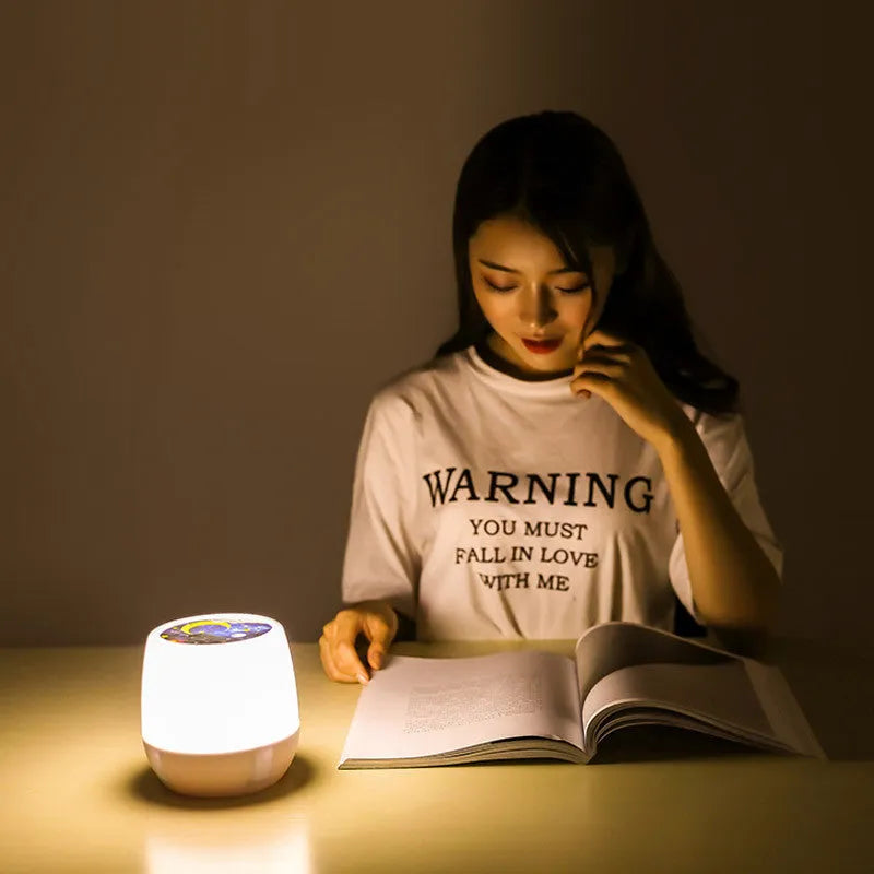 Pruixin PRX1363 LED projector night light displaying rotating starry sky pattern on a bedroom ceiling.