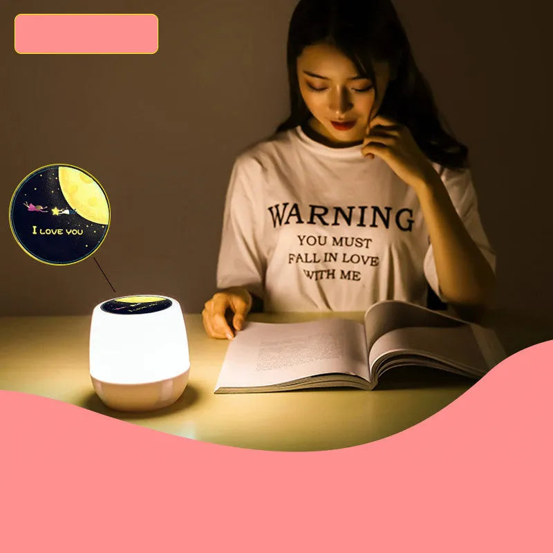 Pruixin PRX1363 LED projector night light displaying rotating starry sky pattern on a bedroom ceiling.