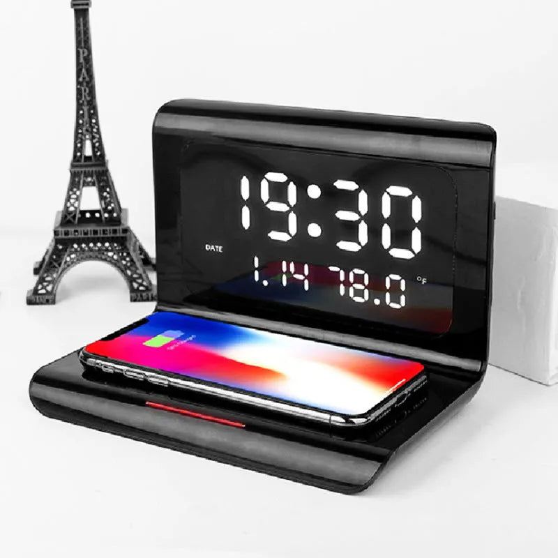 White wireless charger alarm clock showing time, date, temperature and humidity with charging surface