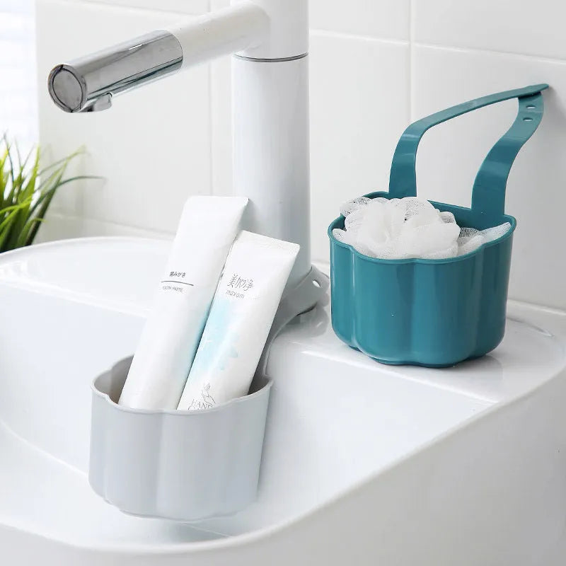 Dark blue Nordic style plastic drain basket next to a kitchen sink