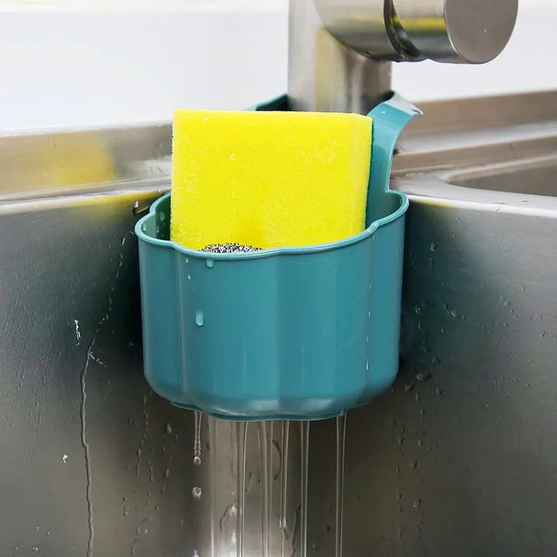 Dark blue Nordic style plastic drain basket next to a kitchen sink