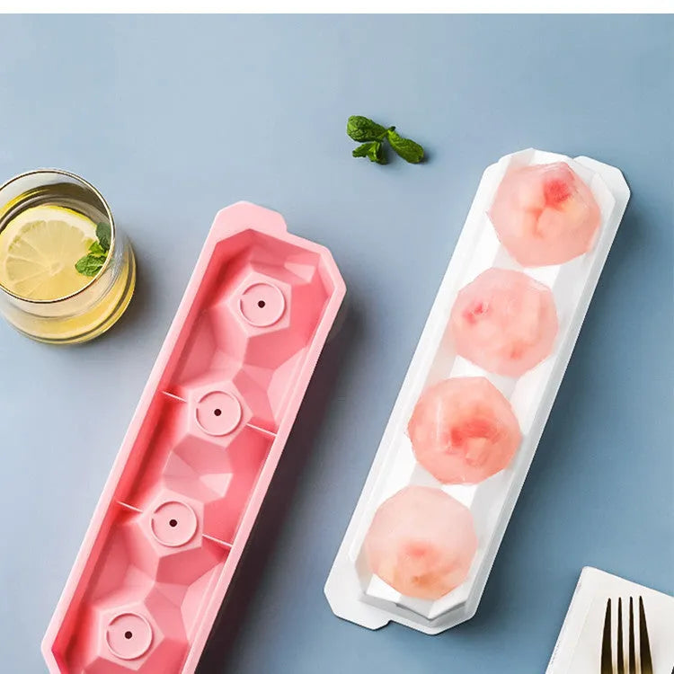 Silicone ice tray showing hockey puck moulds and spherical ice moulds in light blue colour