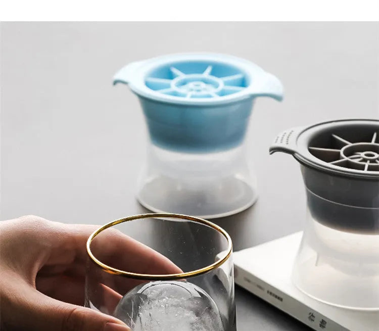 Silicone ice tray showing hockey puck moulds and spherical ice moulds in light blue colour
