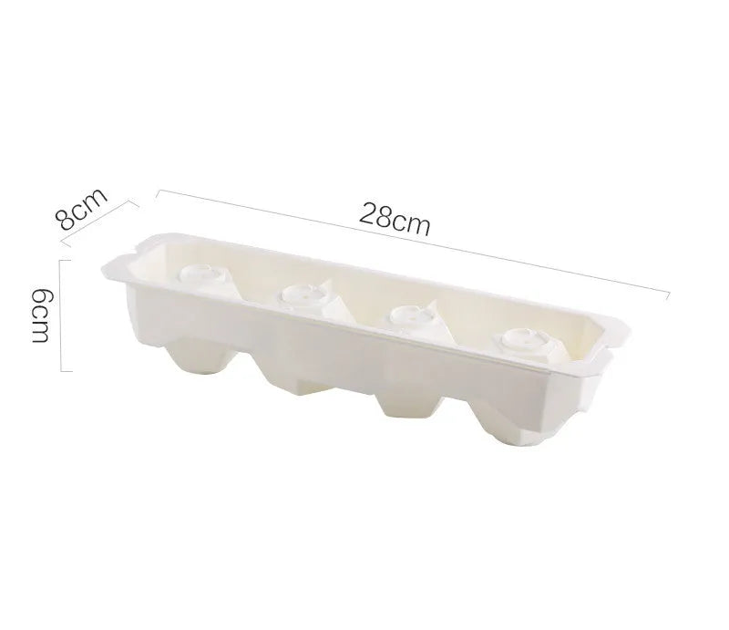 Silicone ice tray showing hockey puck moulds and spherical ice moulds in light blue colour