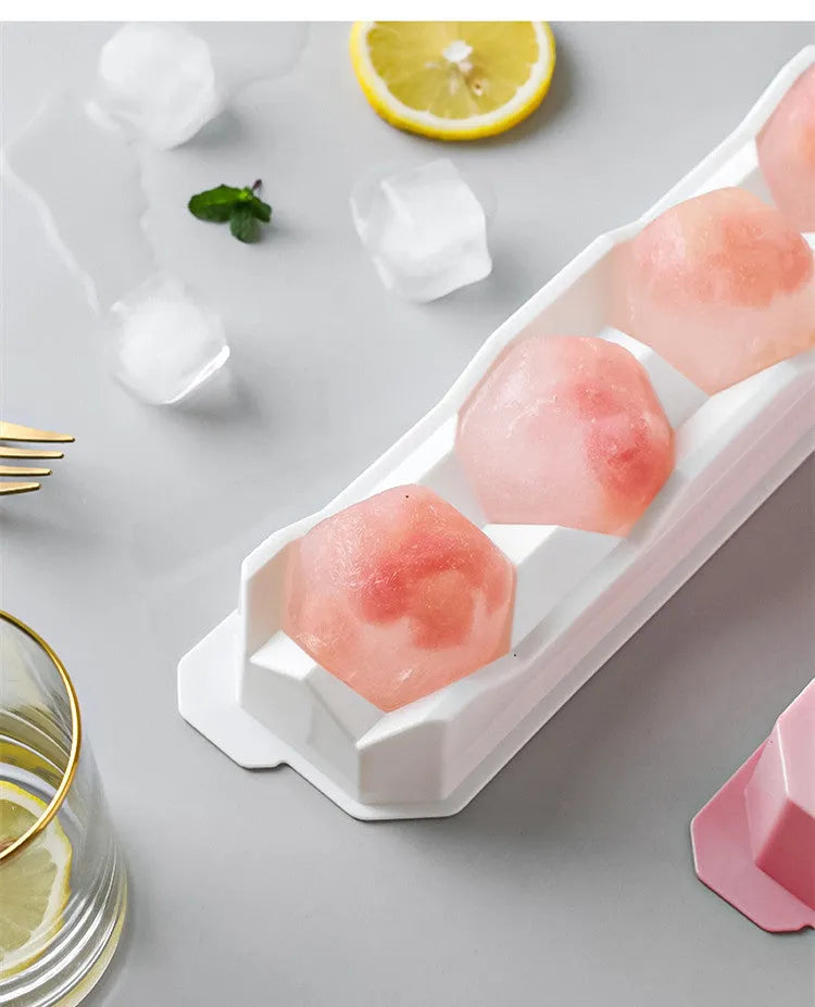 Silicone ice tray showing hockey puck moulds and spherical ice moulds in light blue colour
