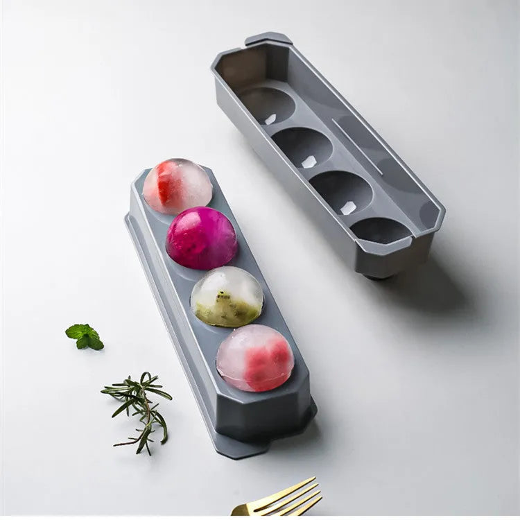 Silicone ice tray showing hockey puck moulds and spherical ice moulds in light blue colour