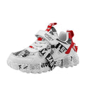 Children's blue and red Velcro sports sneakers with a rubber sole on a white background.