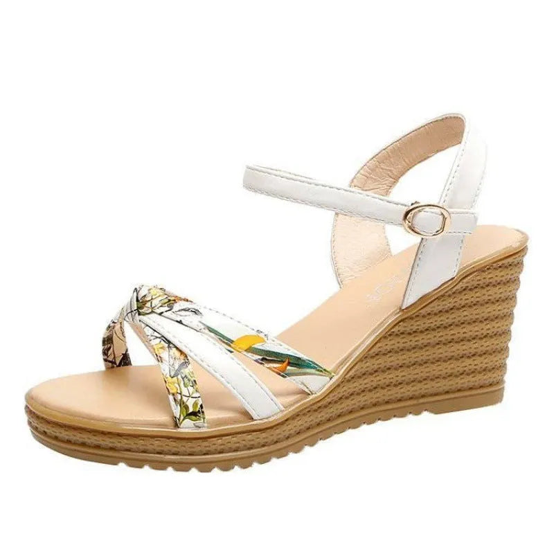 Women's pink wedge sandals with a fish mouth open toe and a buckle strap on a non-slip sole.