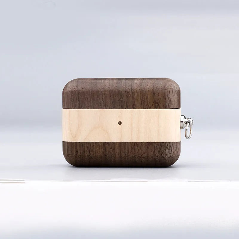 Solid wood Bluetooth earphone sleeve in a choice of natural wood finishes next to wireless earphones