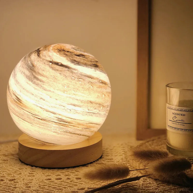 Nordic style USB table lamp with glass shade in amber colour on bedside table
