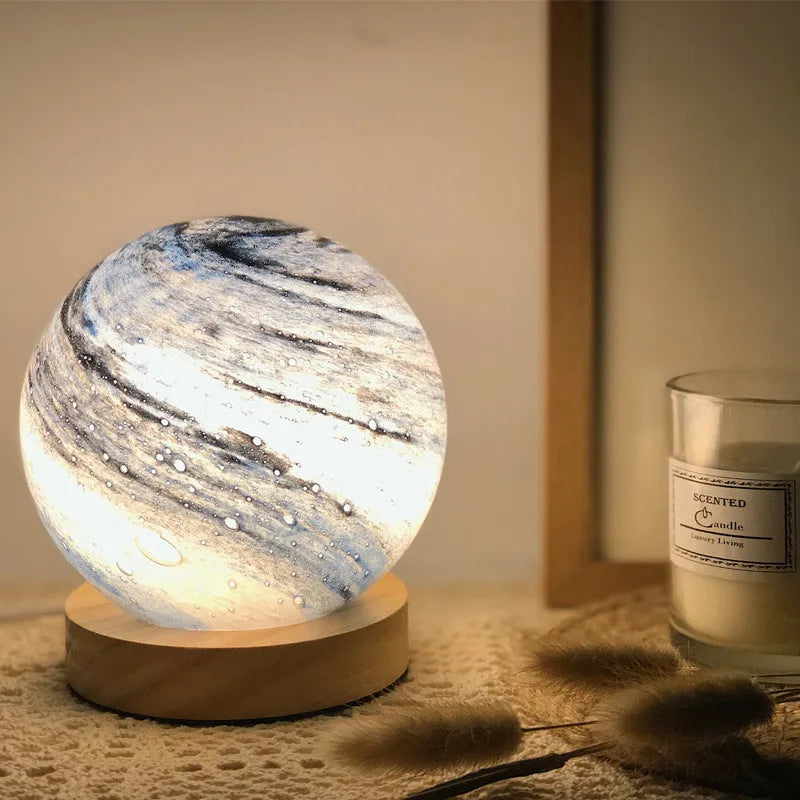 Nordic style USB table lamp with glass shade in amber colour on bedside table