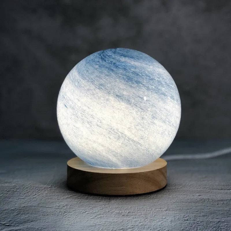 Nordic style USB table lamp with glass shade in amber colour on bedside table