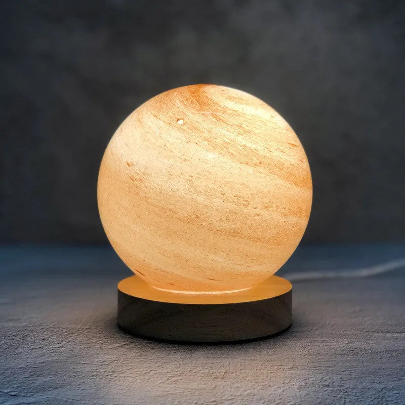 Nordic style USB table lamp with glass shade in amber colour on bedside table