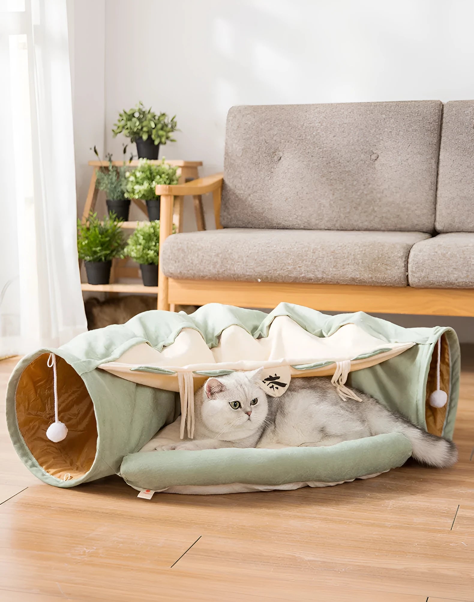 Collapsible cloth cat tunnel in Pink colour, shown extended for play.