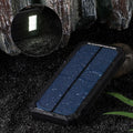 Orange Three Proofs solar power bank showing multiple USB ports and displaying 20000mAh capacity