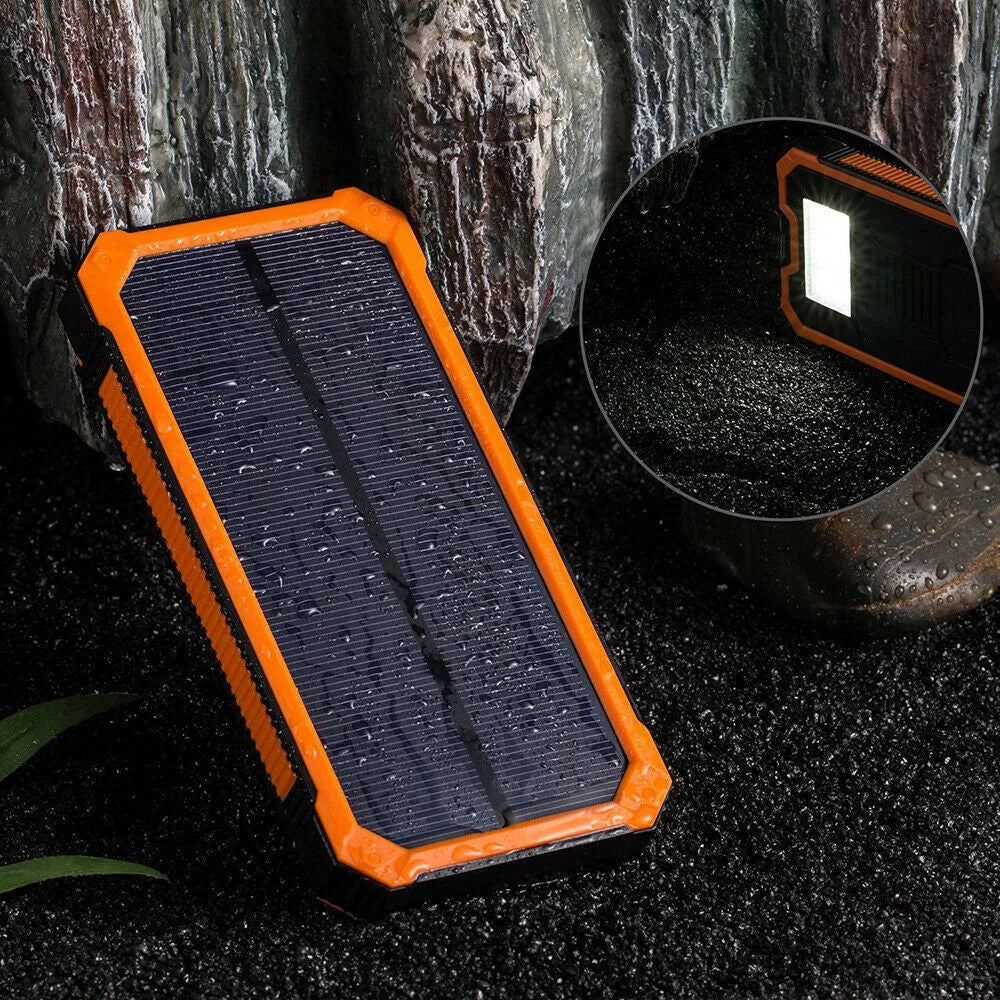 Orange Three Proofs solar power bank showing multiple USB ports and displaying 20000mAh capacity