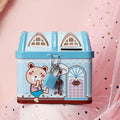 Blue house-shaped tinplate piggy bank for coins on a wooden desk